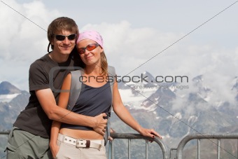 Young couple high in the mountains
