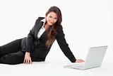 attractive young businesswoman working with laptop computer smiling