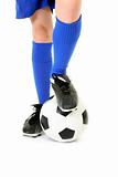 Boy with foot on soccer ball