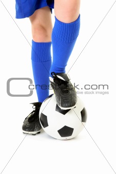 Boy with foot on soccer ball