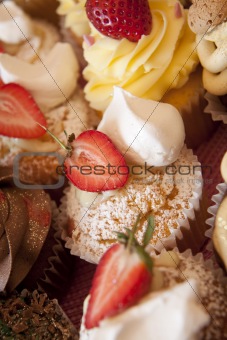Various cupcakes at a bakesale