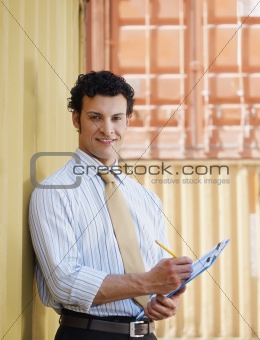 business man with shipping containers