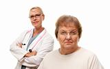 Concerned Senior Woman with Doctor Behind Isolated on a White Background.