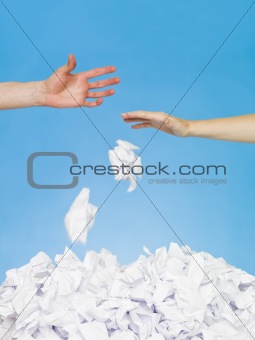 Hands trowing papers
