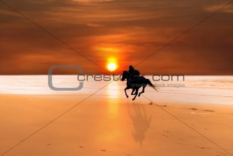silhouette of a horse and rider galloping