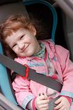 Cute little girl in a baby car seat