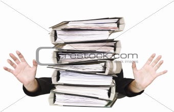 Human behind a stack of Ring Binders