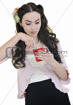 beautiful young woman with red coup of coffee isolated on white