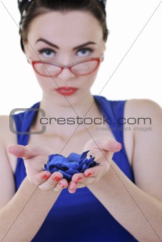 young woman holding blue flower in hands