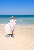 woman on the beach with a white sarong