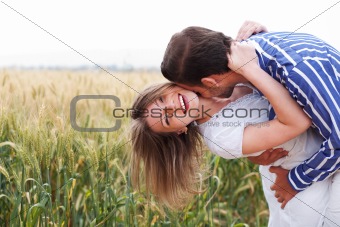 Happy young Couple hugging and kissing eachother