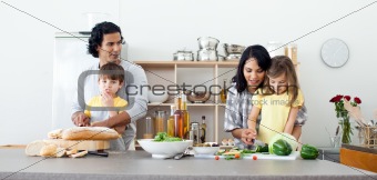Portrait of a family preparing lunch