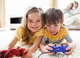 Adorable siblings playing video game 