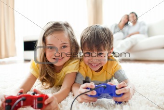 Loving siblings playing video game