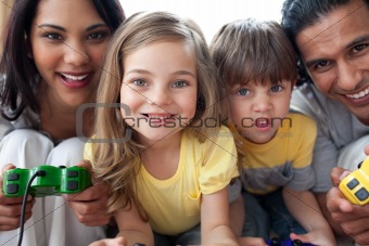 Close-up of family playing video game 
