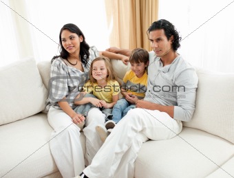 Portrait of a family sitting on sofa 