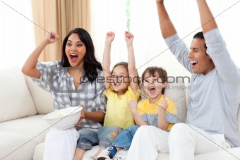 Animated family watching TV on sofa