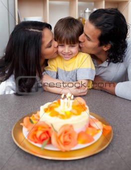 Smiling family celebrating a birthday together