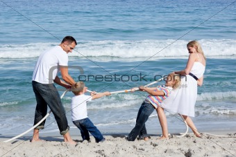 Excited family playing tug of war 