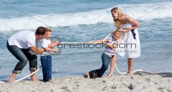 Lively family playing tug of war 
