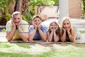 Lovely family on there backyard and looking at you  