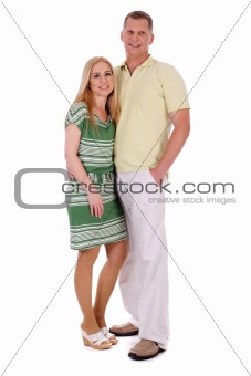 Full length of smiling middle aged couple standing and looking at you