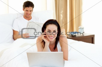 Charming woman using laptop