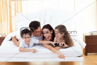 Siblings with their parents having fun