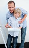 Happy father and his son renovating home
