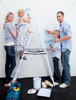 Happy Family decorating their new home