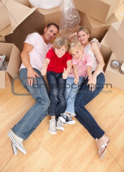 Happy family relaxing in their new house