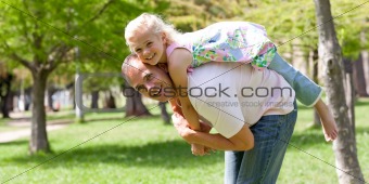 Happy little girl having fun with her father