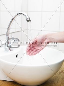Hand and water