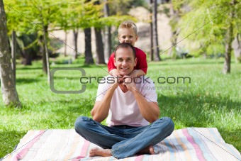 Father and his son having fun at a picnic