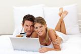 Cheerful couple shopping online 