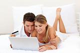 Smiling couple shopping online 