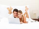 Happy couple surfing the internet 
