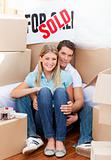 Intimate couple embracing after move in