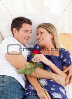 Enamored lovers relaxing on sofa