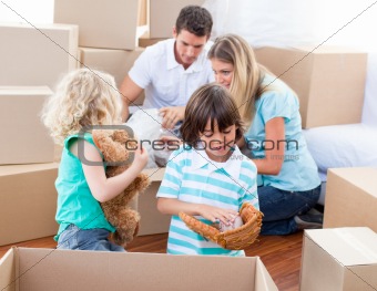 Caucasian family packing boxes