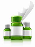 three green medical bottles with medication