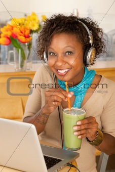 Woman With Laptop and Smoothie