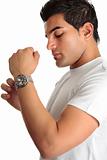 Man putting on chronograph watch