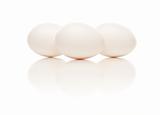 Three White Eggs Isolated on a White Background.