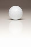 Single White Golf Ball on a Gradated White Background.