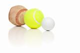 Baseball, Tennis and Golf Ball Isolated on a White Relfective Background.