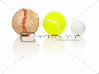 Baseball, Tennis and Golf Ball Isolated on a White Relfective Background.