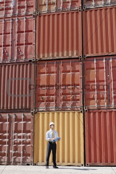 businessman with cargo containers