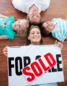 Happy family celebrating buying their new house