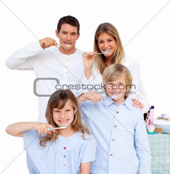 Merry family brushing their teeth in the bathroom